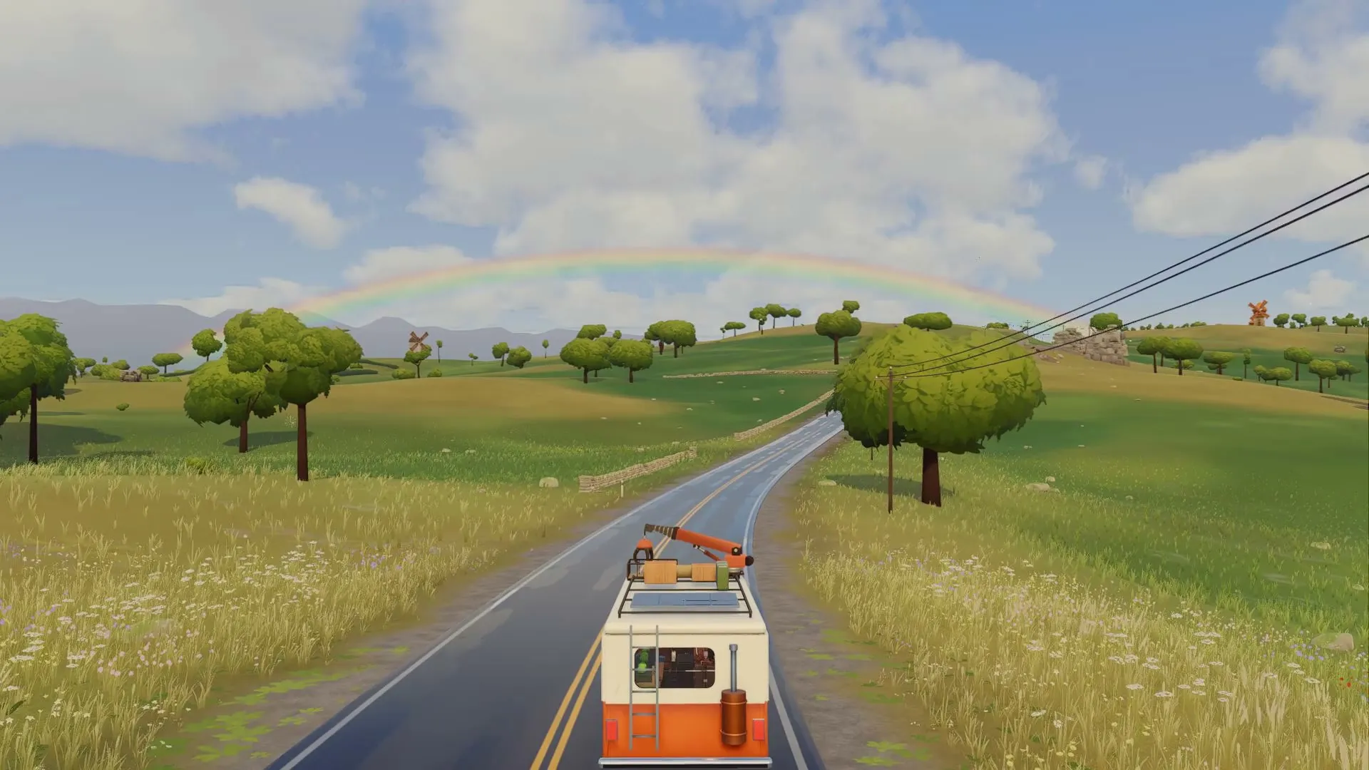 The van on a long road under a rainbow
